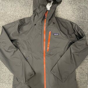 Patagonia Men's Charcoal Raincoat with Bright Orange Zipper size medium